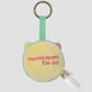 Meowcaron Colgante de bolso de peluche Wink 7 cm
